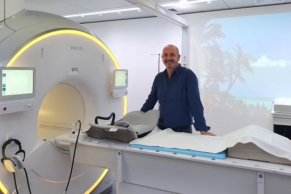 Glenn Cahoon next to the MR-Linac